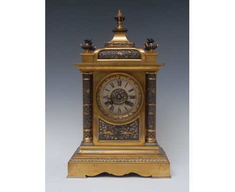 A 19th century French brass mantel clock, the silvered chapter ring with Roman numerals, twin winding holes, eight day moveme