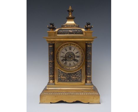 A 19th century French brass mantel clock, the silvered chapter ring with Roman numerals, twin winding holes, eight day moveme