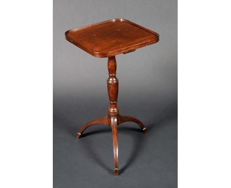 A 'George III' mahogany tripod wine table, rounded rectangular top with shallow gallery, turned urnular pillar, downswept leg