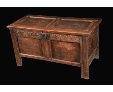 A 17th century oak two-panel blanket chest, hinged top above a carved frieze, stile feet, 55cm high, 107cm wide, c.1680-1700