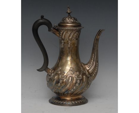 A late Victorian silver baluster coffee pot, embossed in the Rococo Revivalist taste, scrolling ebonised handle, 28cm high, H