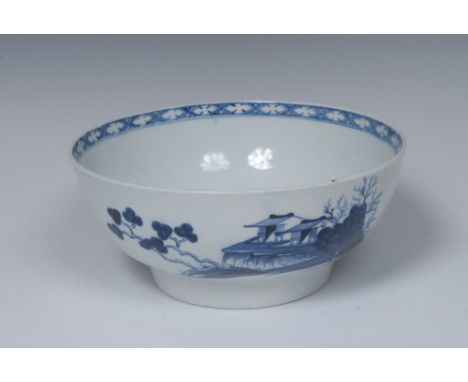 A Worcester Precipice pattern punch bowl, painted in underglaze blue with huts, trees and foliage, the interior with landscap