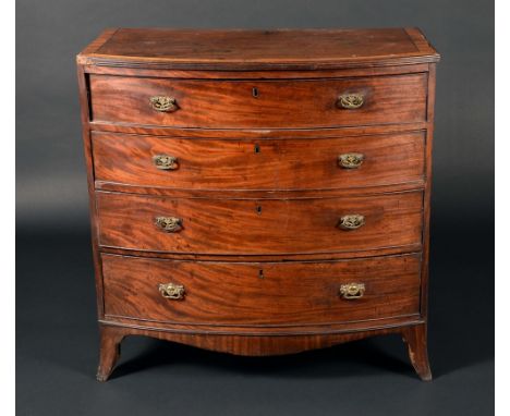 A George III mahogany bow-fronted chest of four long graduated cockbeaded drawers, satinwood crossbanded top outswept bracket