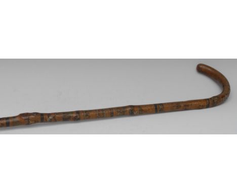 Folk Art - an early 20th century novelty hawthorn walking stick, totem decorated with tiered reserves of a bright sun, figure
