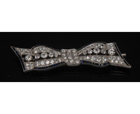 A diamond and sapphire tied ribbon bow brooch, pave set with sixty six round old cut diamonds, total estimated diamond weight