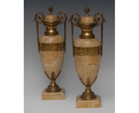 A pair of French Louis XVI Revival gilt-metal mounted marble twin-handled mantel urns, the vasular balusters inset with a pan