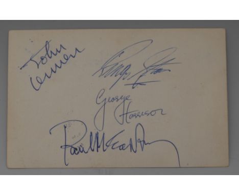 Autographs - The Beatles, b/w band postcard, the verso signed in blue biro by its members John Lennon, Paul McCartney, Ringo 