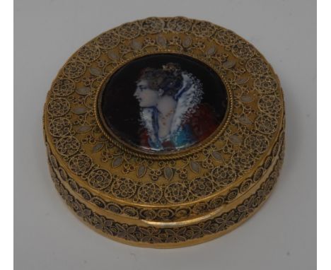 A late 19th century French gilt-metal and Limoges enamel circular bonbonnière, the cover applied with a portrait roundel of a
