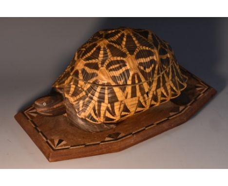 A Colonial novelty box or caddy, formed from the shell and plastron of a tortoise, hinged cover enclosing a lidded compartmen