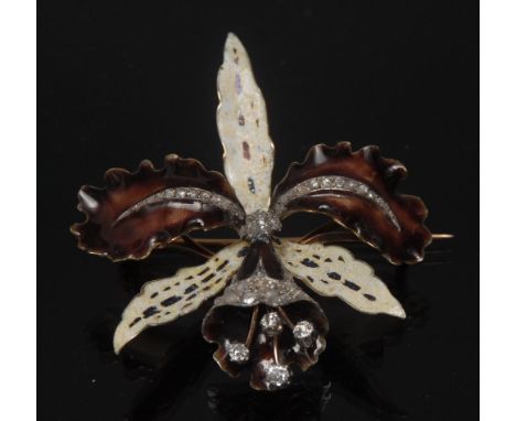 A diamond encrusted enamel orchid brooch, three creamy tapering petals, and two arching umber brown leaves above a tubular fl