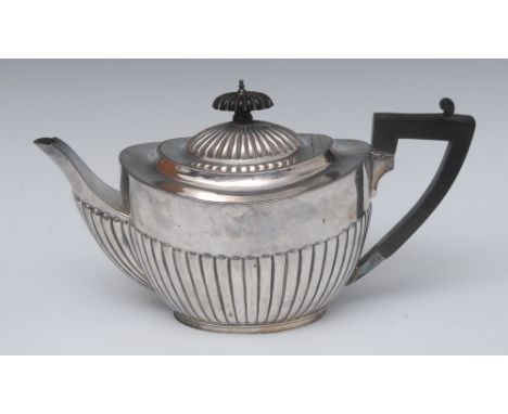 A Victorian silver half fluted teapot, ebonised angular handle, fluted button finial, 16cm high, W & G Sissons (William & Geo