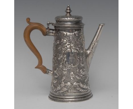 A George II silver spreading cylindrical coffee pot, bell-shaped knop finial, hinged domed cover, chased overall with flowers