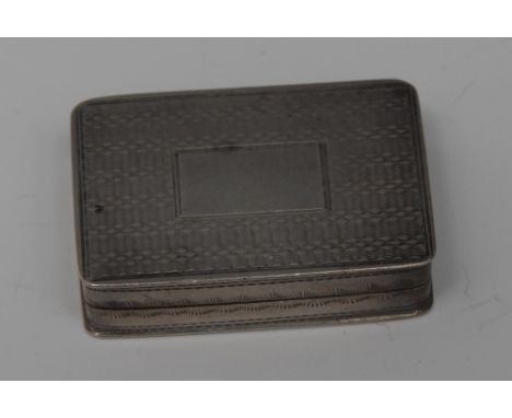 A Victorian silver rounded rectangular vinaigrette, engine turned overall, hinged cover centred by a vacant rectangular reser
