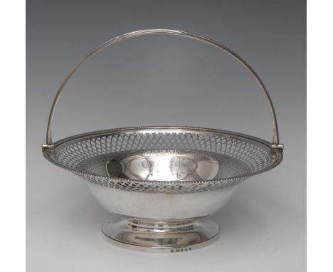 Paul Storr - a George III silver circular cake basket, reeded swing handle, gadrooned rim, lattice pierced border outlined wi