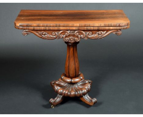 A William IV rosewood pedestal card table, rounded rectangular moulded top enclosing a baize-lined playing surface above a sh