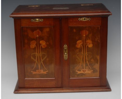An Art Nouveau mahogany and marquetry rectangular table-top smoker's compendium, the moulded hinged cover inset with a silver