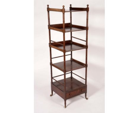 A George IV mahogany five-tier whatnot, sphere finials, rectangular plateaux, ring-turned supports, drawer to base, brass cas