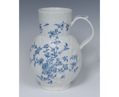 A Worcester Cabbage Leaf Floral pattern Dutch jug, decorated in underglaze blue with scrolling foliage on a relief moulded gr