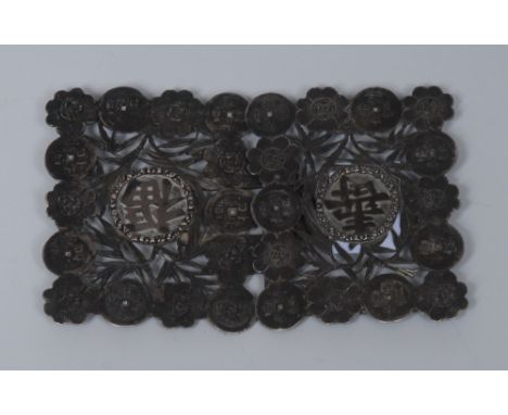 A Chinese silver shaped rectangular buckle, pierced, embossed and applied with characters, roundels and flowerheads, 9.5cm wi