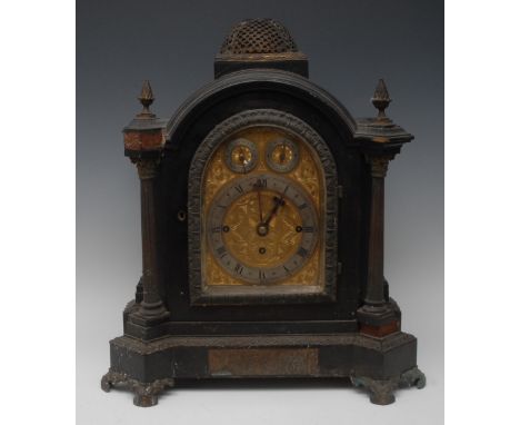 A Victorian ebonised bracket clock, 16cm arched brass dial with silvered chapter ring, inscribed with Roman and Arabic numera