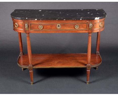 A French Directoire ormolu mounted console dessete, marble top above a long drawer, flanked by masks, loose ring handles, tur