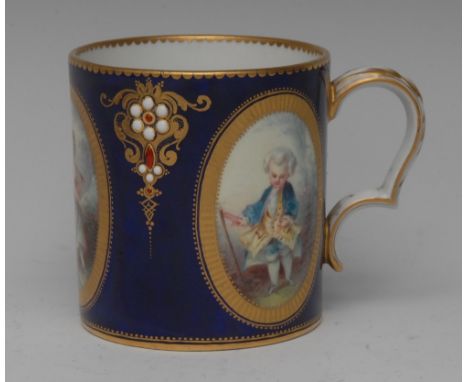 A Sevres style coffee can/mug,  painted with three tooled gilt panels of children acting as adults, divided by red and white 
