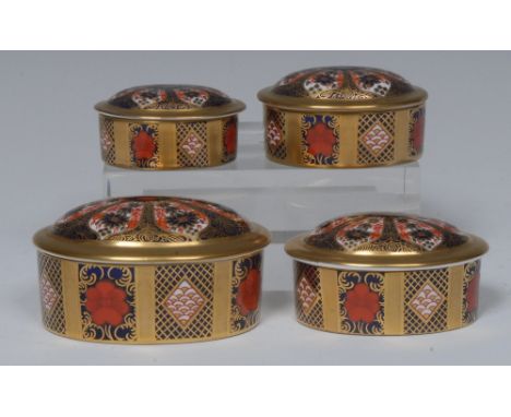 A graduated set of four Royal Crown Derby 1128 pattern oval trinket jars and covers, solid gold band, 9.5cm wide, printed mar