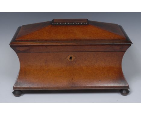 A 19th century burr walnut sarcophagus tea caddy, the interior with central mixing bowl flanked by two lidded compartments, t