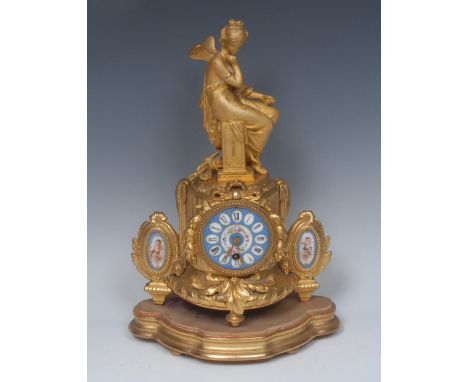 A 19th century French gilt metal and porcelain mounted mantel timepiece, 8cm dial painted in the manner of Sevres and inscrib