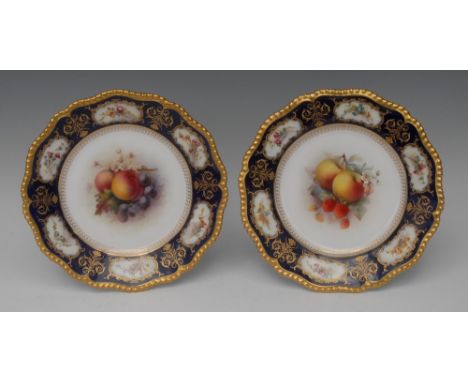 A pair of Royal Worcester shaped circular plates,  painted by H. Martin, signed, with fruit and blossom, the border painted w