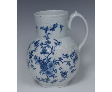 A Worcester Cabbage Leaf Jug Floral pattern Dutch jug, decorated in underglaze blue with scrolling foliage on a relief moulde