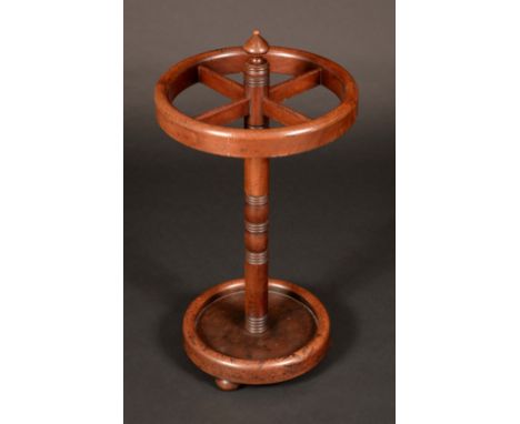 A Victorian mahogany circular four section walking stick stand, turned column, dished base, bun feet, 73cm high, 40cm diam,  