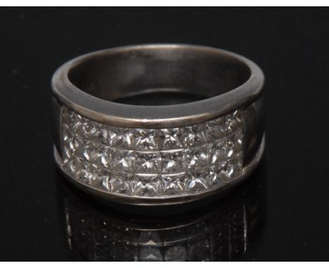 A gentleman's diamond panel ring, rectangular panel of twenty seven princess cut square diamonds, total estimated diamond wei