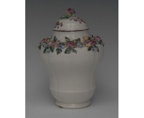 A Mennecy lobed ogee shaped vase and cover,  encrusted with band of flowers to shoulders, domed cover, flower finial, leafy m