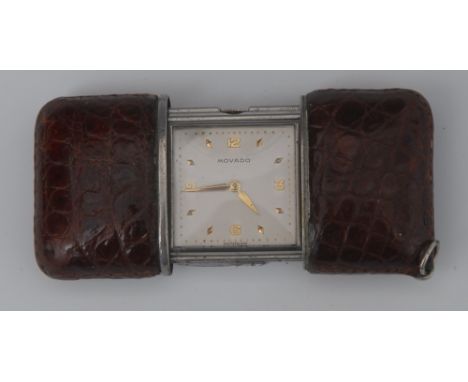 A lady's purse watch, the rectangular champagne dial inscribed  Movado, Arabic numerals to quarters, sliding  crocodile skin 