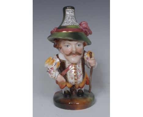 A Royal Crown Derby Tall Mansion House Dwarf, he stands holding a stick, wearing a pointed hat and waistcoat jacket, circular