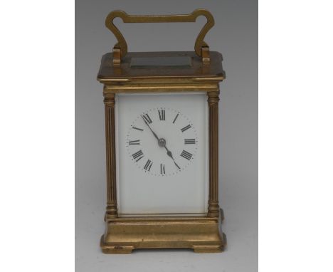 An early 20th century French lacquered brass clock, 6cm white enamel dial painted with Roman numerals, eight-day movement str