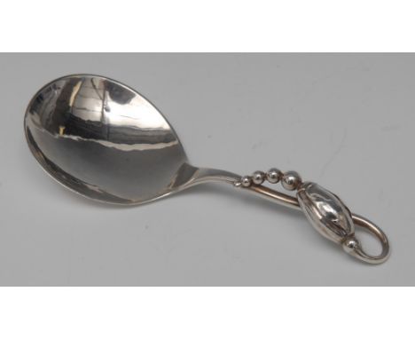 Georg Jensen - a Danish silver Blossom pattern caddy spoon, 10cm long, initials and dotted monogram, import marks for London 