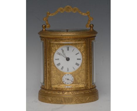 A late 19th century gilt brass oval five-glass alarm carriage clock, 5cm enamel dial inscribed with Roman numerals, above an 