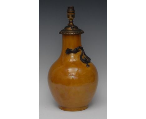 A Chinese monochrome ovoid vase, applied with a dragon and glazed in tones of mottled ocre, 32cm high, seal mark, later fitte