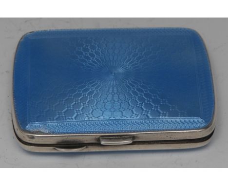 An Art Deco silver and blue enamel rounded rectangular cigarette case, engine turned and decorated to recto and verso in tone