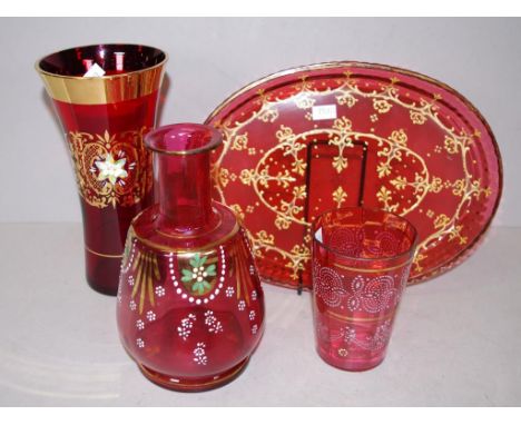 Four vintage ruby glass pieces including gilt decorated serving plate, (diameter 26cm approx); a gilt decorated vase; a hand 