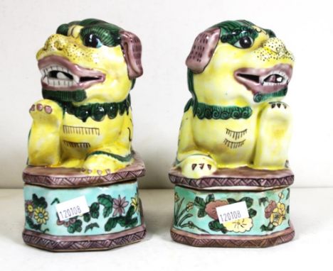 Pair Chinese ceramic Dog of Fo figures each figures forms lid to floral decorated dish below. Height 15cm approx (each).