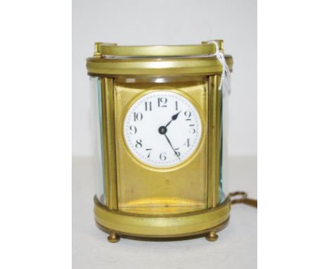 Vintage art deco brass case carriage clock Oval shape case, with lion mark to movement. Key available. Appears operational. H