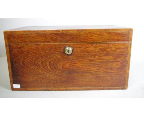 George III casuarina caddy inlaid with Bramah lock, with triple interior and heavy ring handle, circa 1800, 35cm x 16.5cm, 17