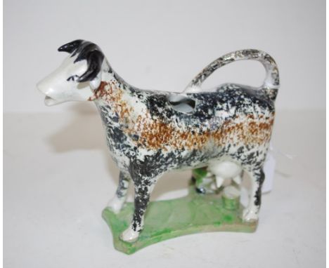 Georgian ceramic cow creamer jug brown and white standing cow, with seated milkmaid below. Length 17cm approx. Height 14cm ap