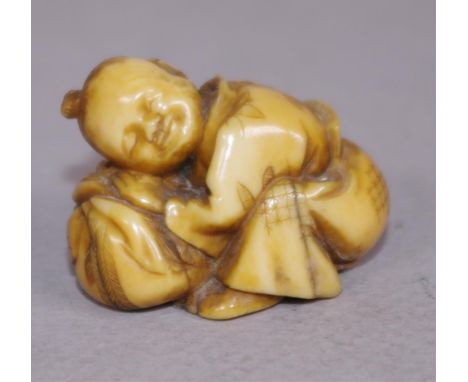 Antique Japanese ivory netsuke -Boy crouched down C1920, signed to base, 3cm high approx. May not be exported without CITES d