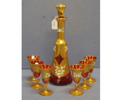 Seven piece Venetian glass liqueur set including decanter and 6 glasses, gilt decorated ruby glass.