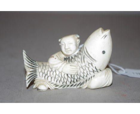 Antique Chinese ivory man with fish figurine C1920, width 7cm approx, May not be exported without CITES documentation.