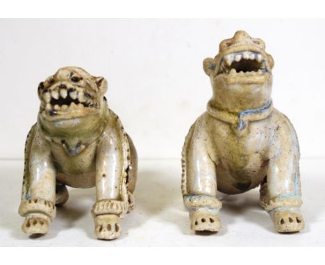 Early pair Chinese ceramic temple dogs Each dog in seated position, (some rim chips to each). Height 12cm approx (taller dog)